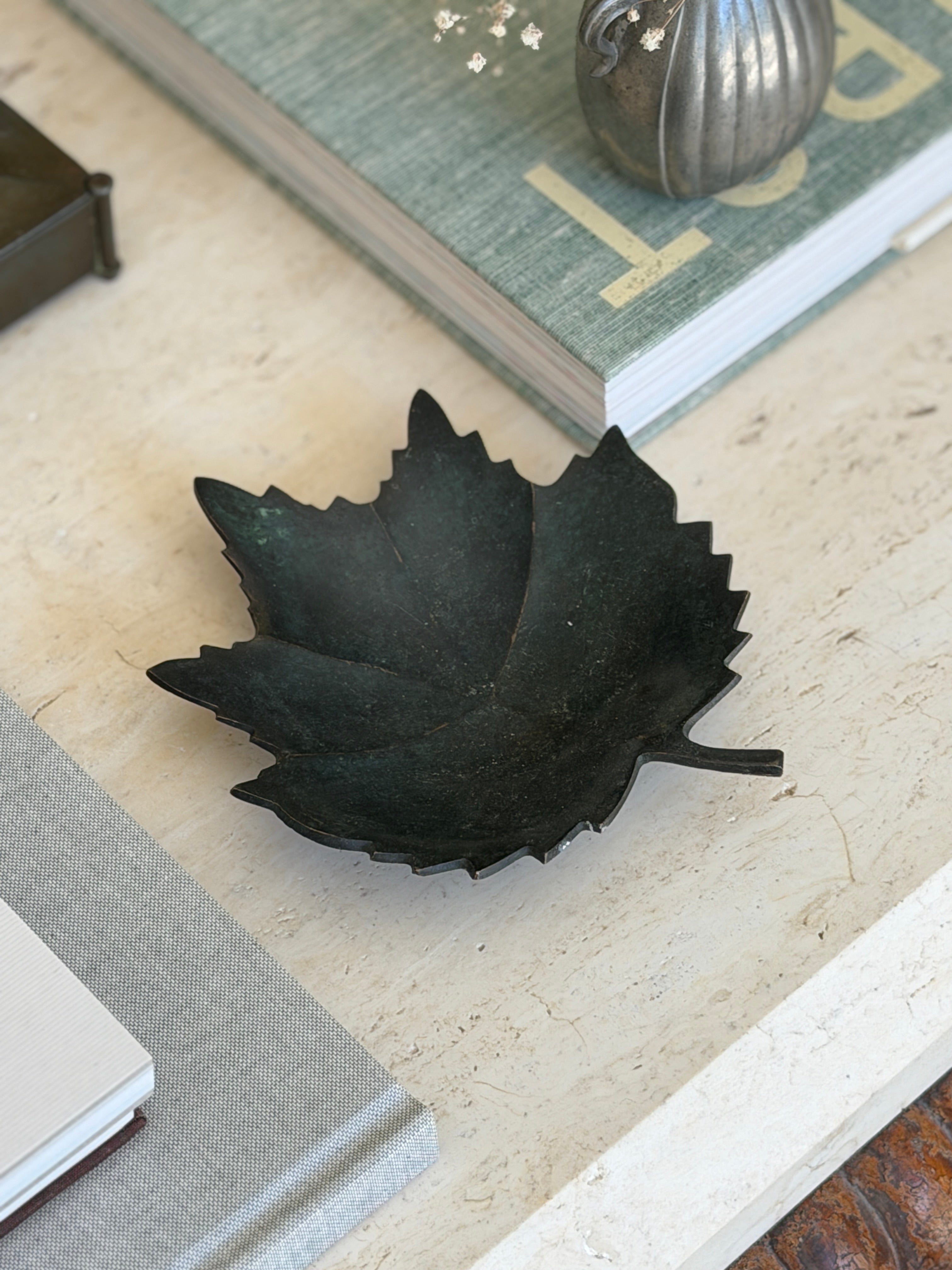 Collectors Gene vintage dark patinated bronze leaf figural vide poche catchall dish on travertine surface