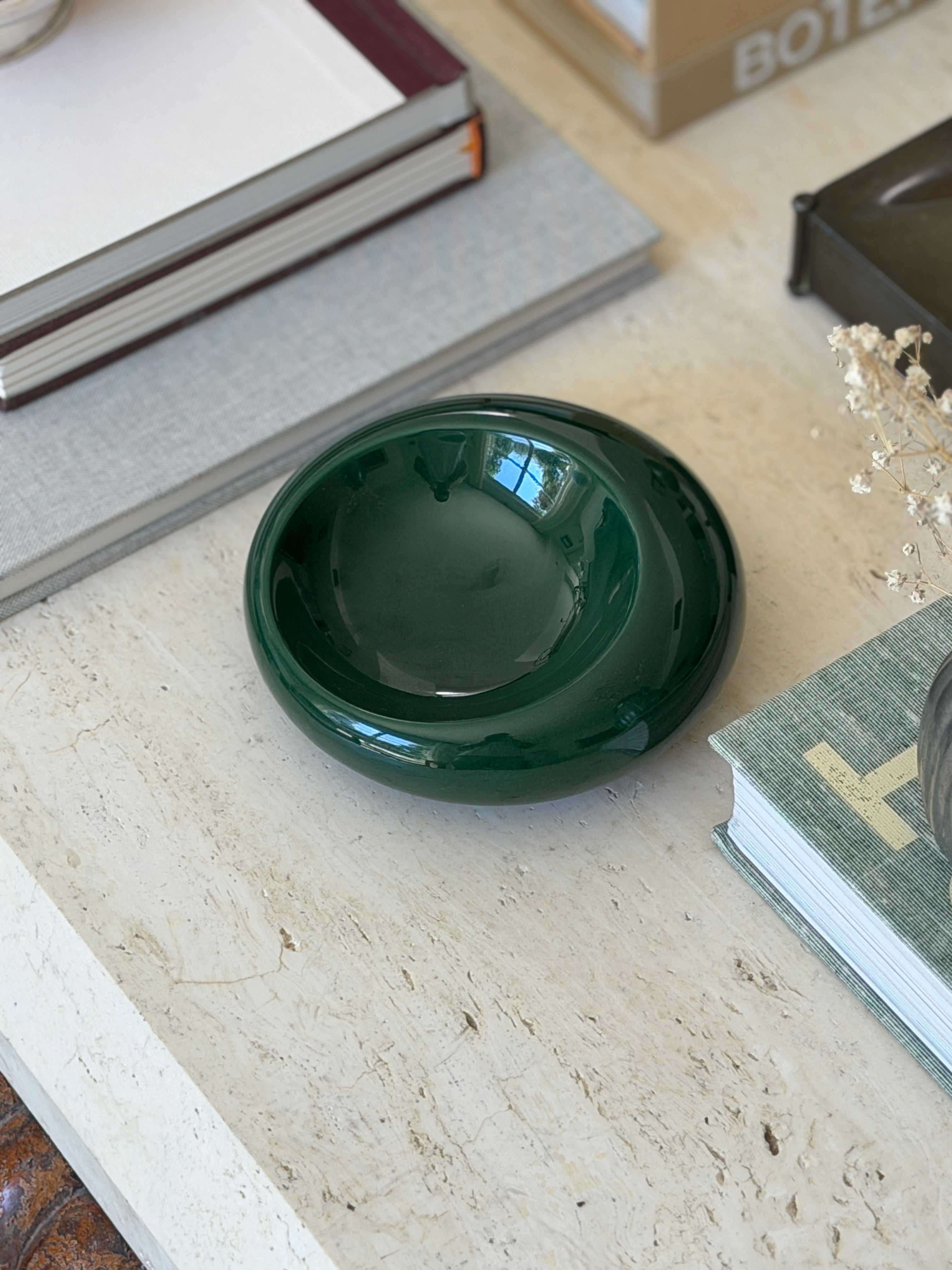Vintage c.1960 Sicart forest green glazed ceramic circular catchall dish styled on travertine console table from Collectors Gene