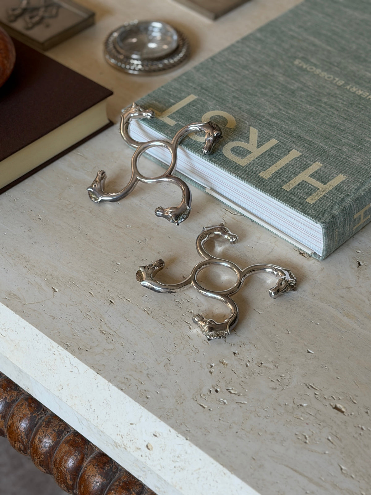 Pair of Hermes sculptural silver horse head bottle coasters, France c.1960