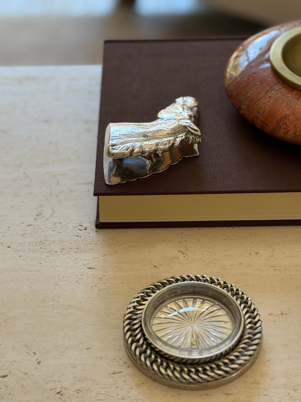 Reverse angle of the Hermes horse head clip, showing the textured, sculpted underside of the mane