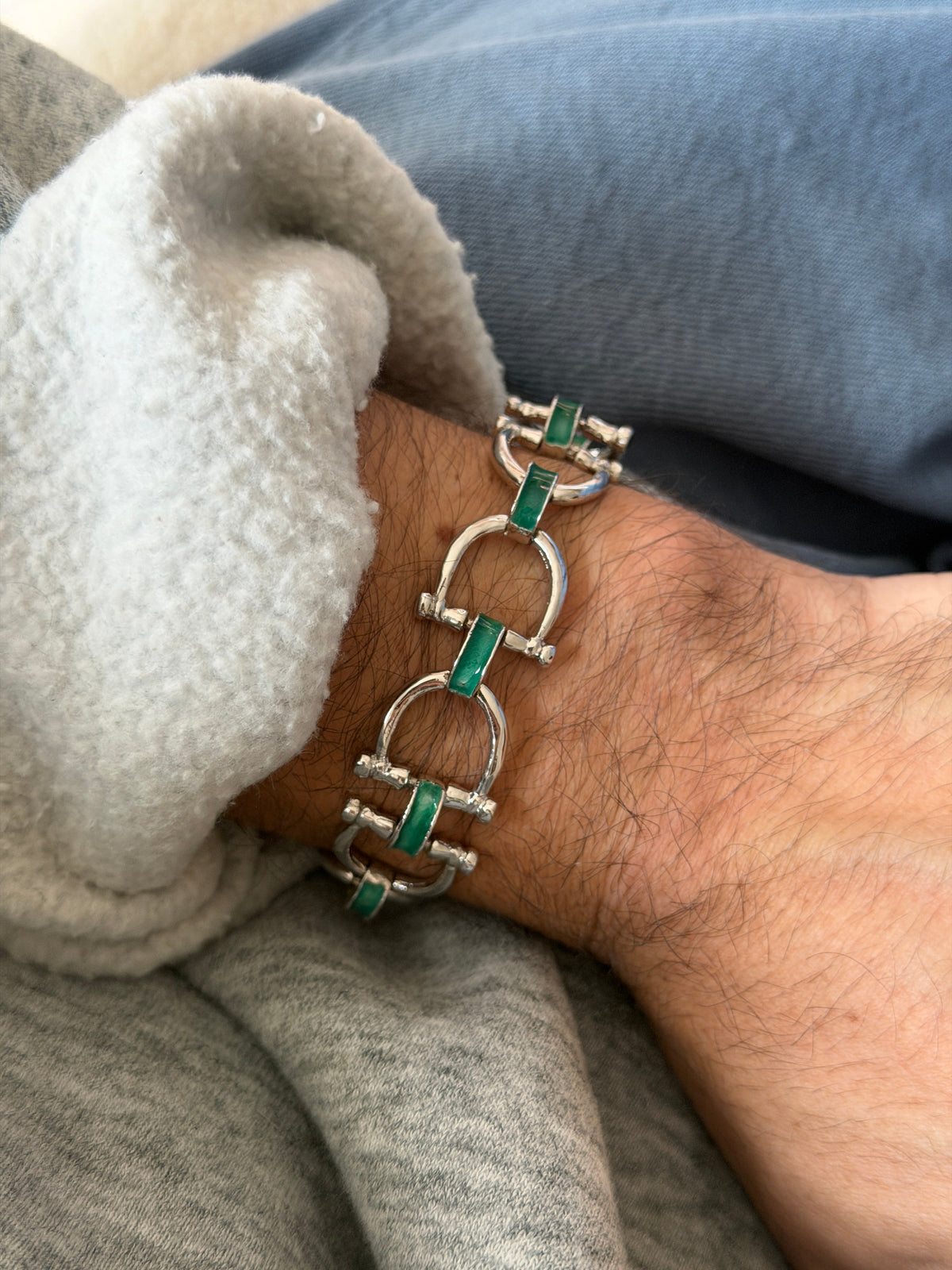 Bertuletti sterling silver link bracelet featuring a green enamel snaffle bit motif