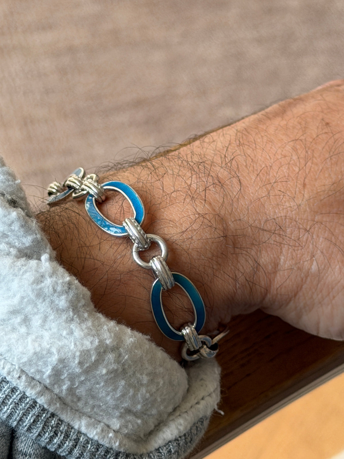 Wrist shot of the bracelet showing the textured toggle clasp mechanism