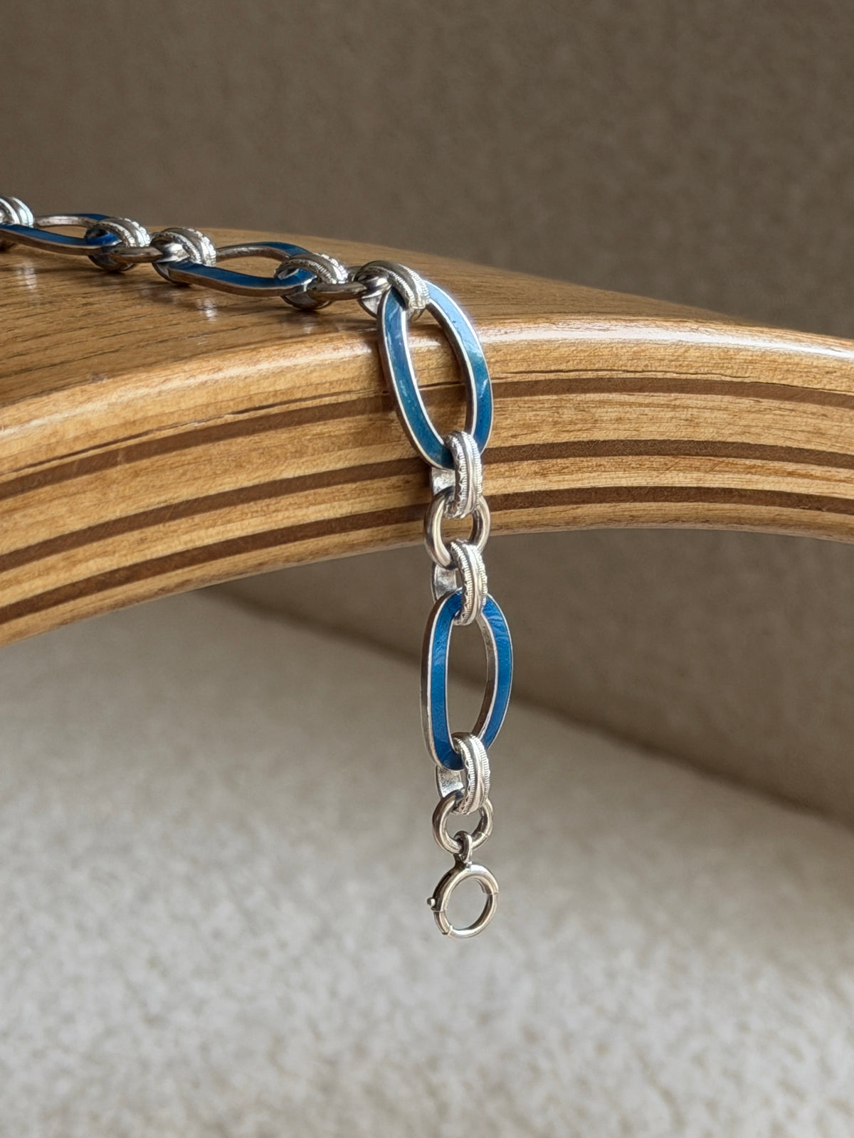 Draped view showing the clasp on the vintage enamel link bracelet