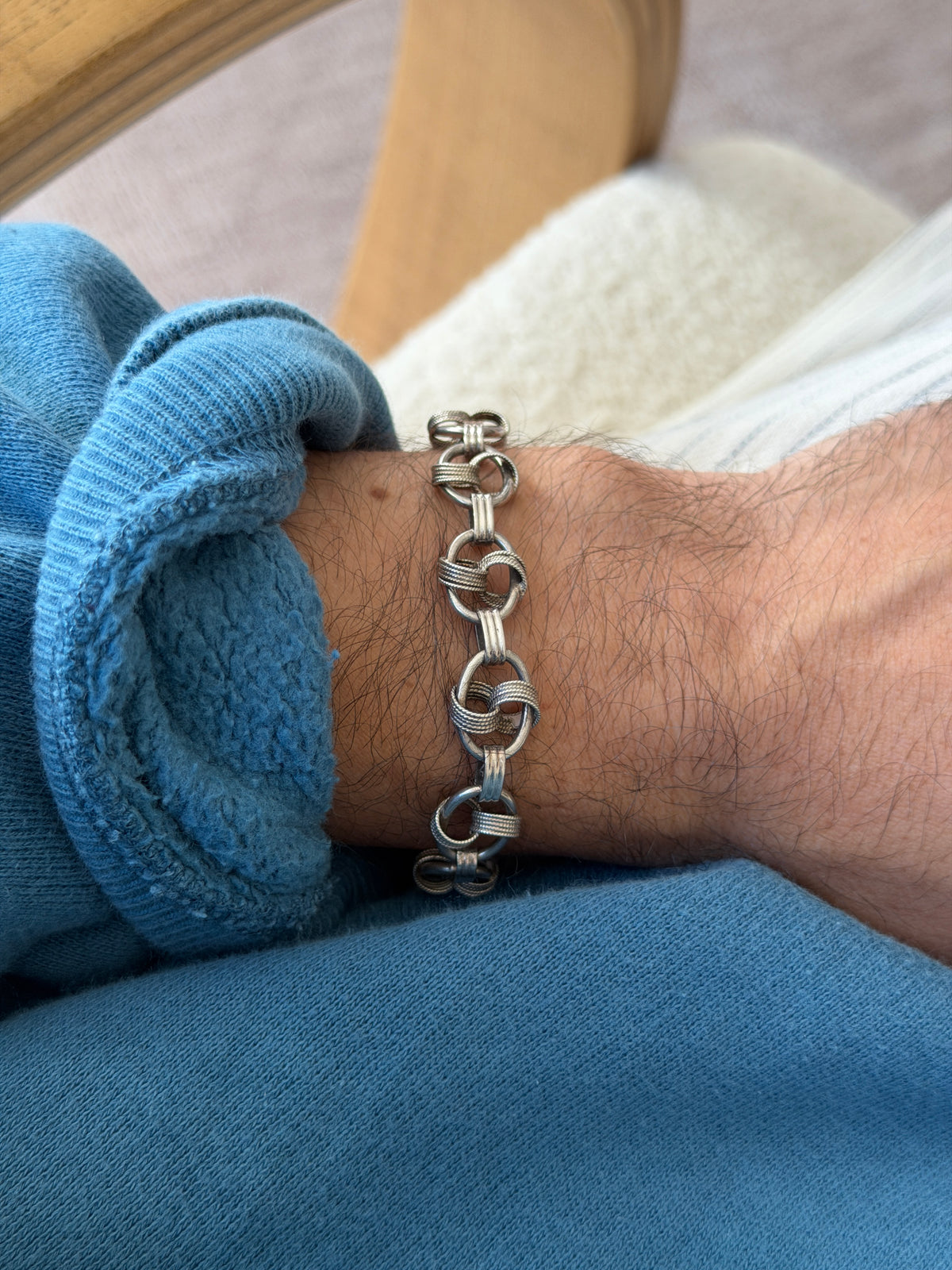 Bracelet worn on the wrist, closer view showing the interlocking link pattern