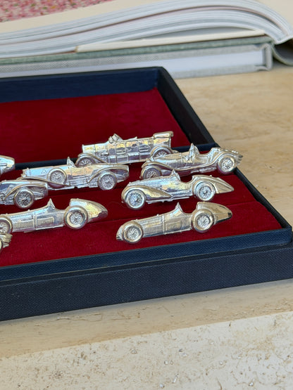 Close view from another angle showing the detailed silhouettes and wire wheels of the car holders