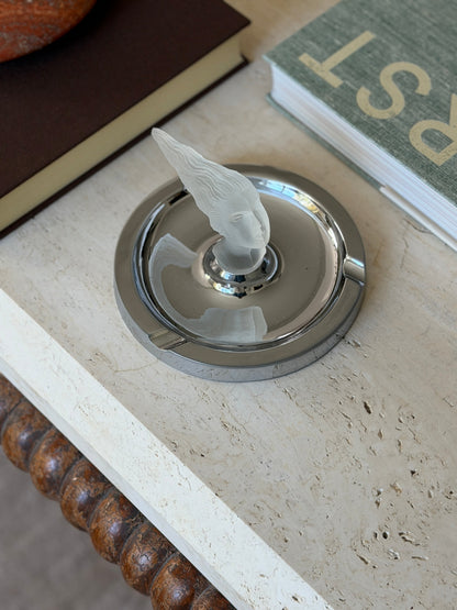 Overhead angled view of the ashtray styled near a marble bowl and stacked books