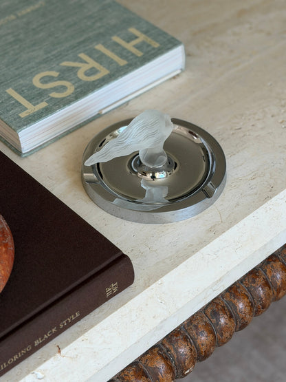 Angled view of the ashtray displayed on a stack of books