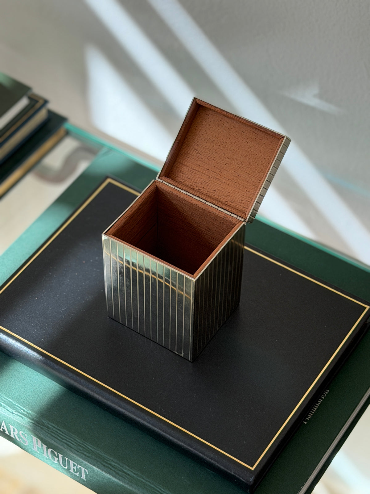 Open view of Art Deco silver plated box showing natural cedar-lined wood interior from Collectors Gene