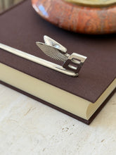 Angled detail of the Flying B emblem on the letter opener, both wings visible behind the squared B at the end of the blade