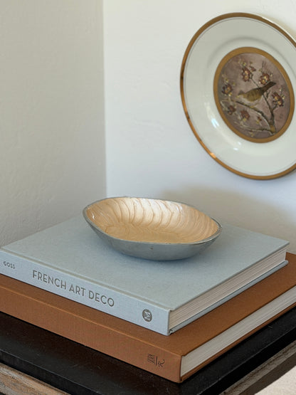 Curated room display shot featuring vintage Italian cream aluminum catchall dish from Collectors Gene