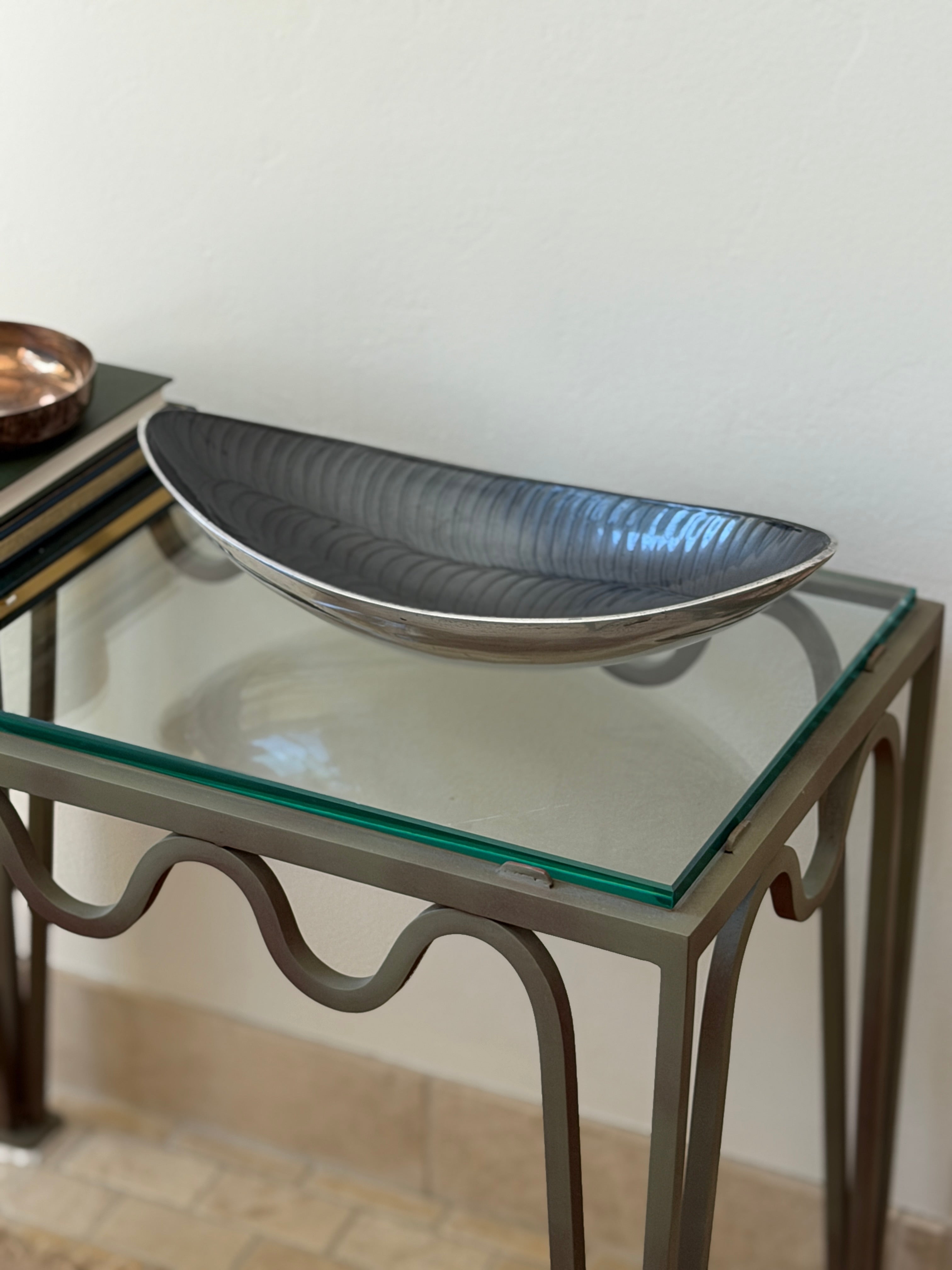 Angled side view of vintage 1980s Italian sculptural aluminum centerpiece bowl available at Collectors Gene