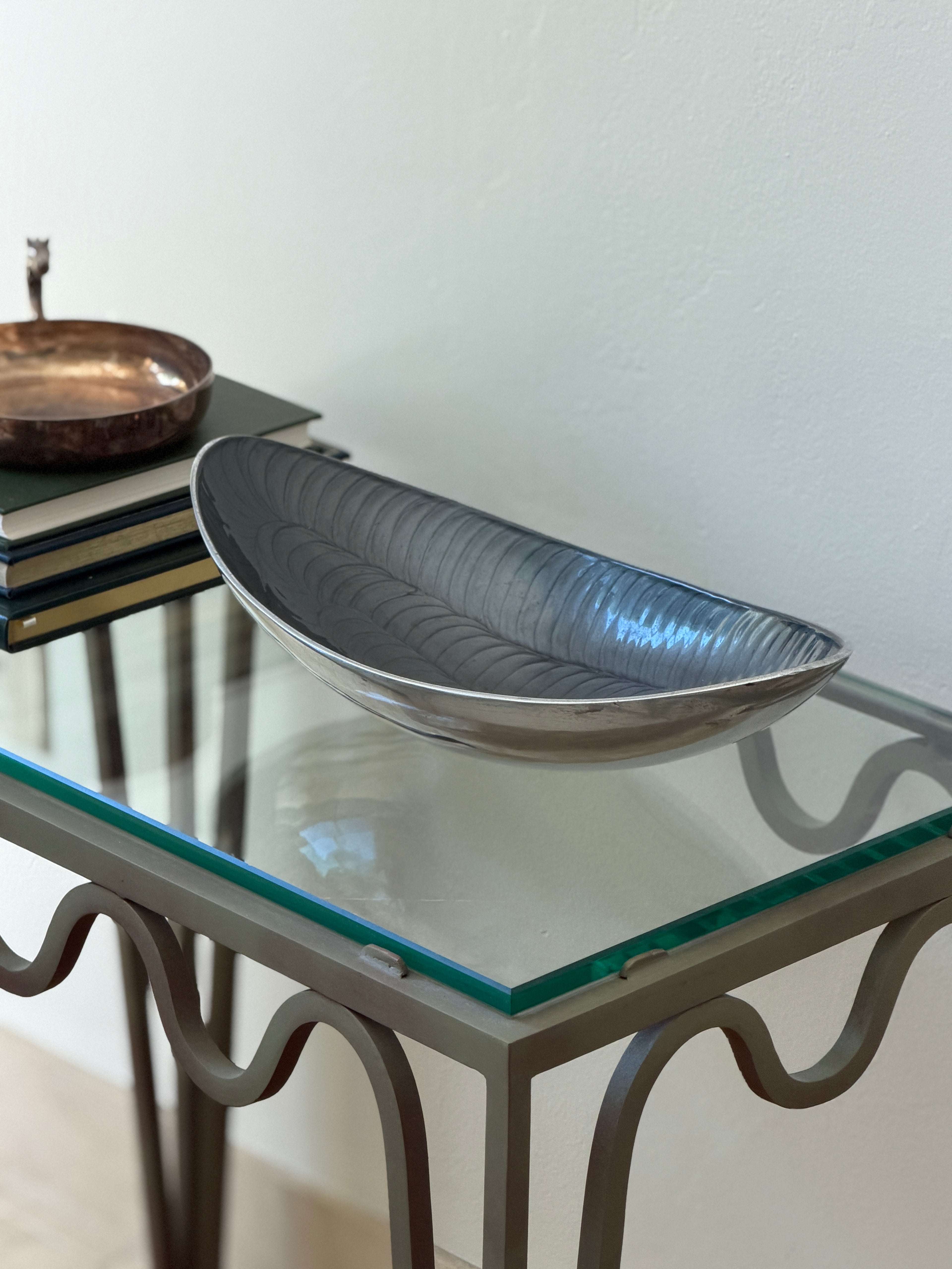 High angle perspective view of dark grey scalloped aluminum centerpiece bowl from Collectors Gene