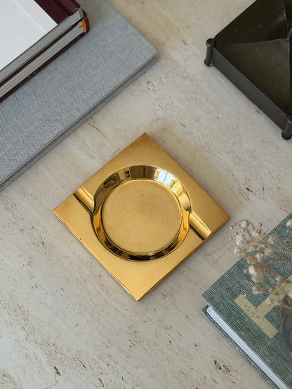 Direct top-down view of square brass ashtray showing circular recessed center well available at Collectors Gene