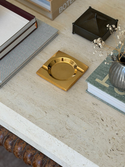 Executive desk context scene featuring 1960s low-profile brass ashtray catchall dish from Collectors Gene
