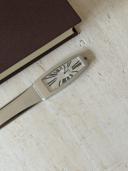 Closer view of the clock face set into the handle, showing the Roman numeral dial and Cartier signature