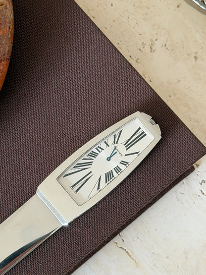 Another close-up of the clock face from the front, showing the hour and minute hands and Roman numerals