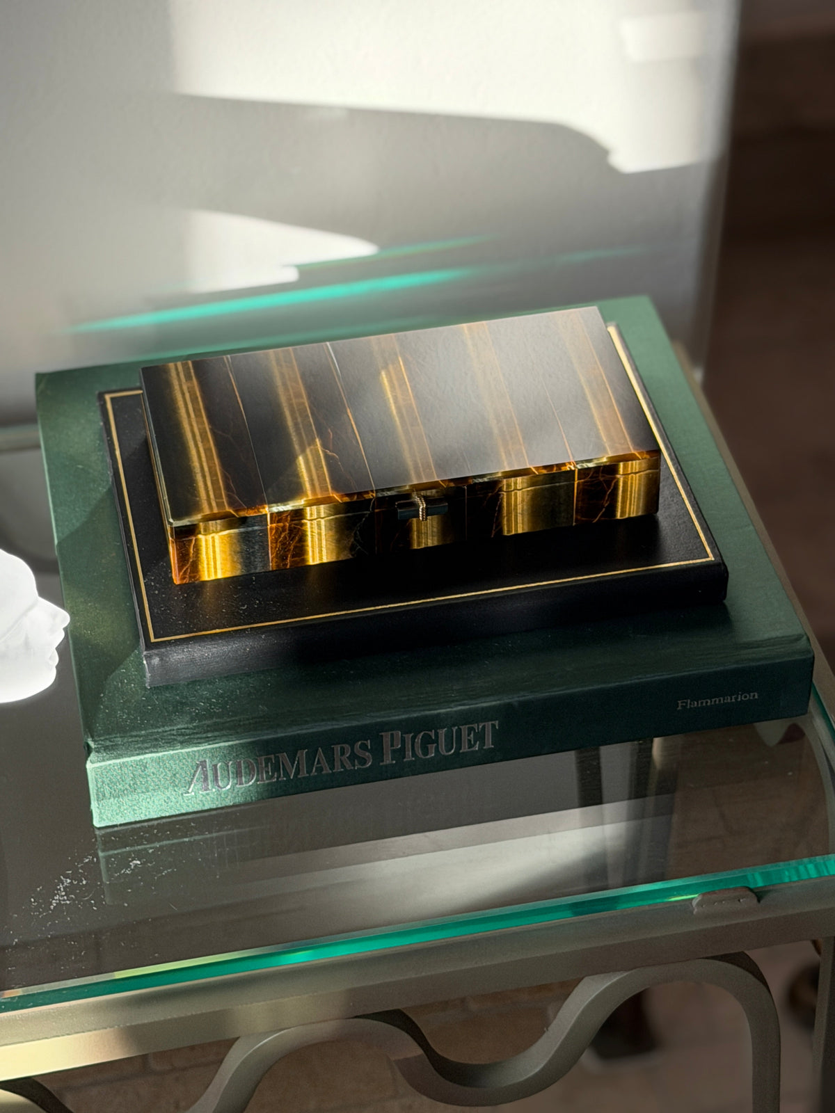 Angled view of the closed Chaumet box displayed among books and decorative objects