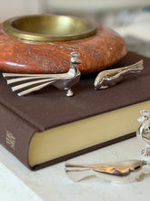 Christofle Gallia knife rests with a dove-form piece in the foreground