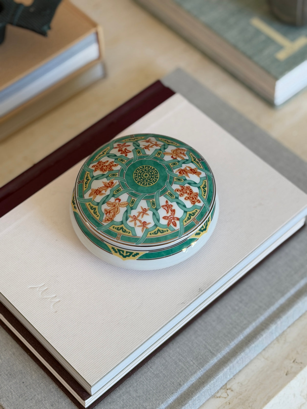 High angle view of round Christofle Paris green ginkgo leaf trinket box available at Collectors Gene