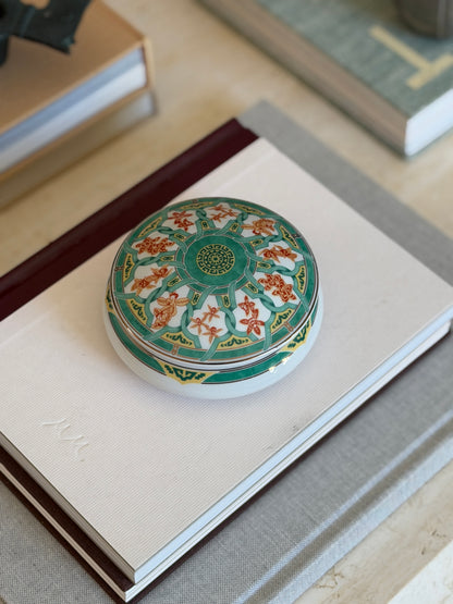 High angle view of round Christofle Paris green ginkgo leaf trinket box available at Collectors Gene