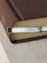 Close up of the inside of the Dunhill cutter lid, stamped DUNHILL LONDON beside English silver hallmarks