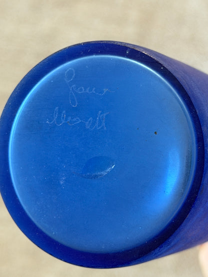 Underside of the blue Murano bottle showing the engraved Franco Moretti signature and polished pontil mark on the base