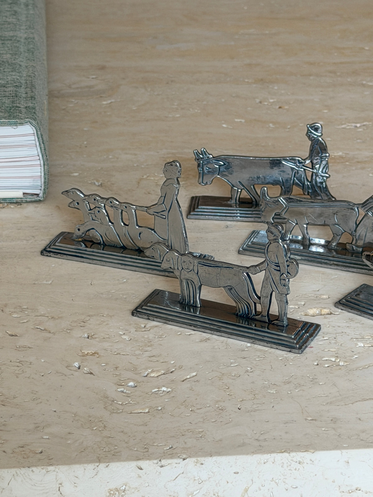 Close-up detail of the cow and geese-flock knife rests from the French set