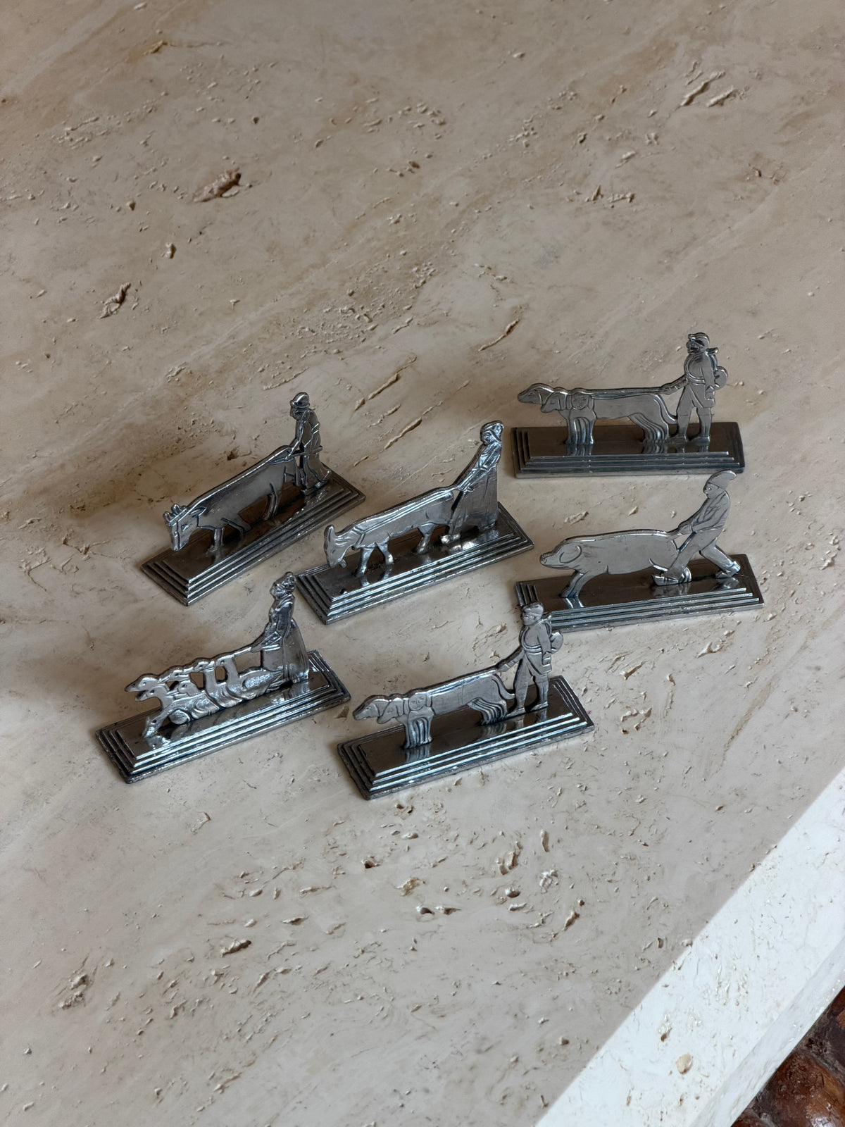 Set of six French Art Deco knife rests cast as farm animal figures