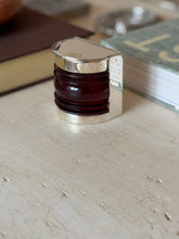 Front-facing view of the Hermes nautical boat light box in silver and maroon