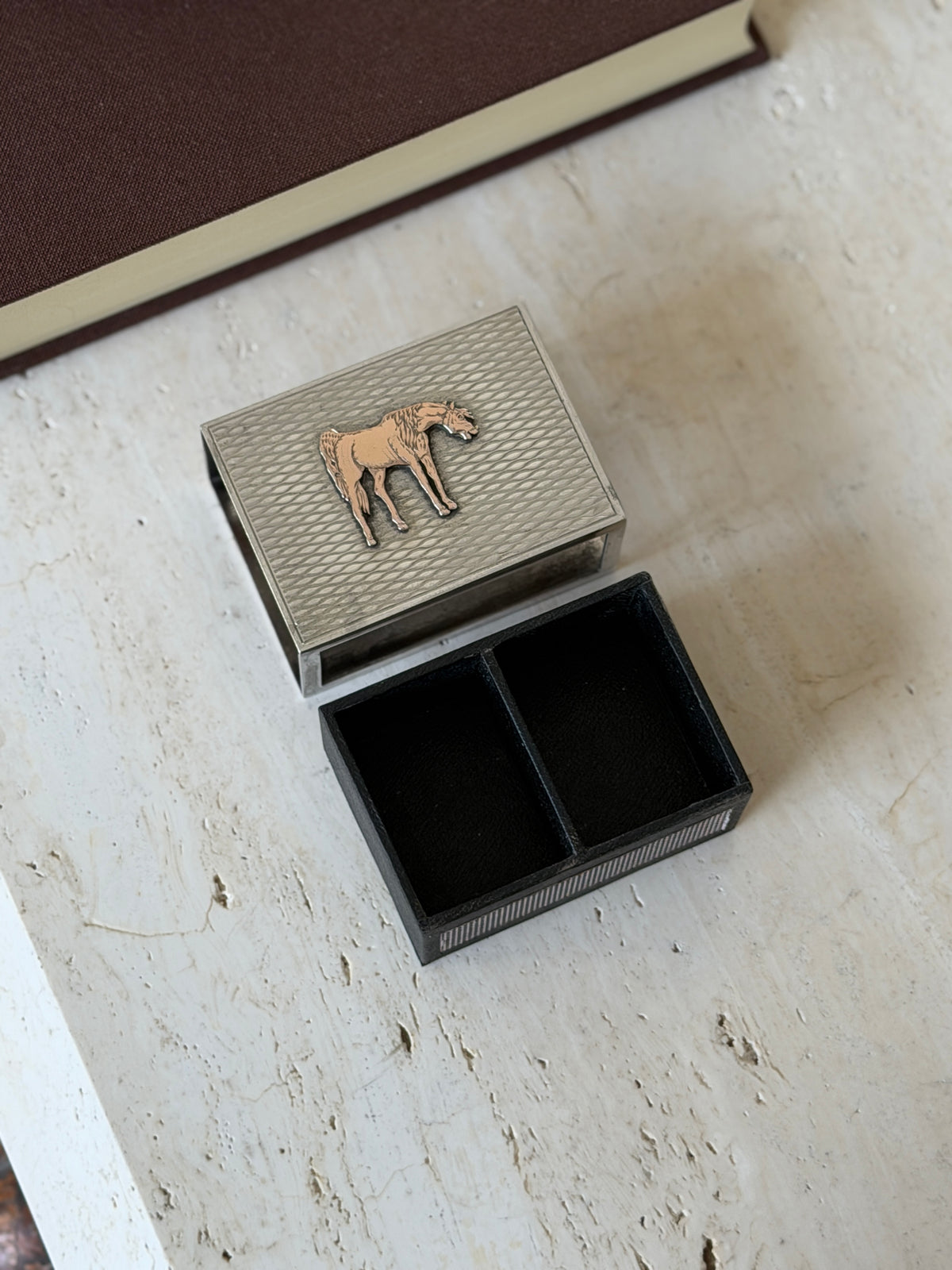 Hermes silver matchbox cover with its black leather lined tray removed, the tray divided into two compartments