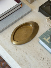 High angle view of elongated oval bronze vide poche tray with asymmetrical raised rim available at Collectors Gene