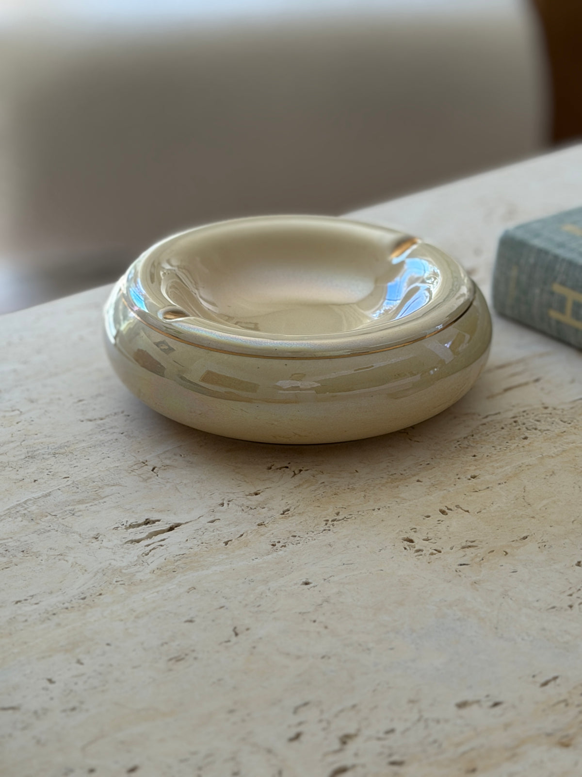 Eye-level profile view of cream and gold mid-century Italian ceramic ashtray available at Collectors Gene