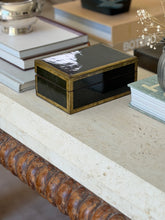 Side profile view of dark green lacquered wood jewelry box on stone console table at Collectors Gene