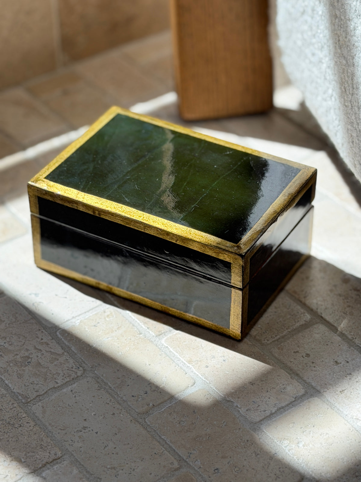 Vintage 1980s Italian forest green lacquered wood box with gold gilt border trim in natural sunlight from Collectors Gene