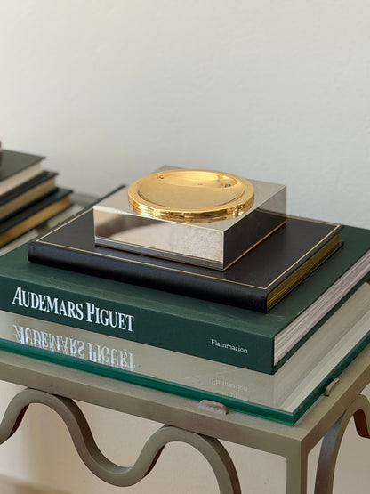 High angle view of square silver and gold-tone two-tone metal vide poche styled on books available at Collectors Gene