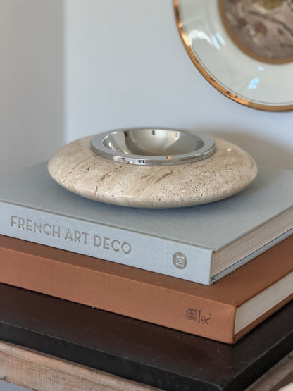 Collectors Gene Italian mid-century cream travertine vide poche tray with polished silver metal bowl center on books