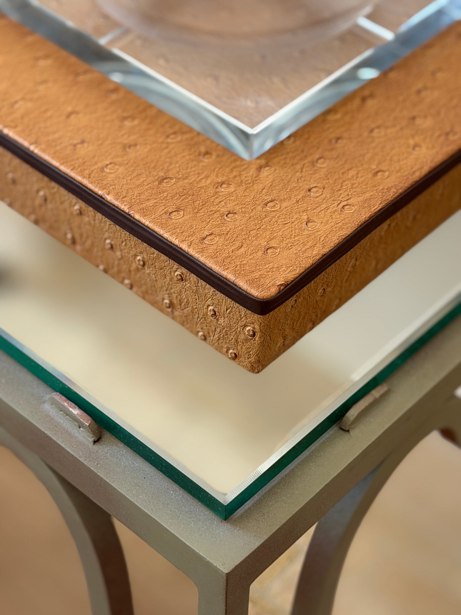 Close-up corner view showing brown faux ostrich leather texture and heavy beveled glass bowl liner from Collectors Gene