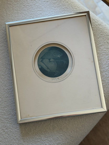 John P. Morgan Nightbird mezzotint in a round cream mat and brushed silver frame, resting on a cream boucle cushion