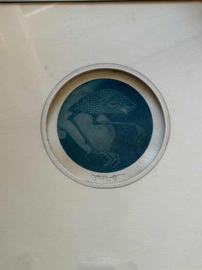 Close view of the Nightbird mezzotint, a scaled, hooded bird perched on a thin branch against a deep blue ground, signed in pencil and numbered 11/20