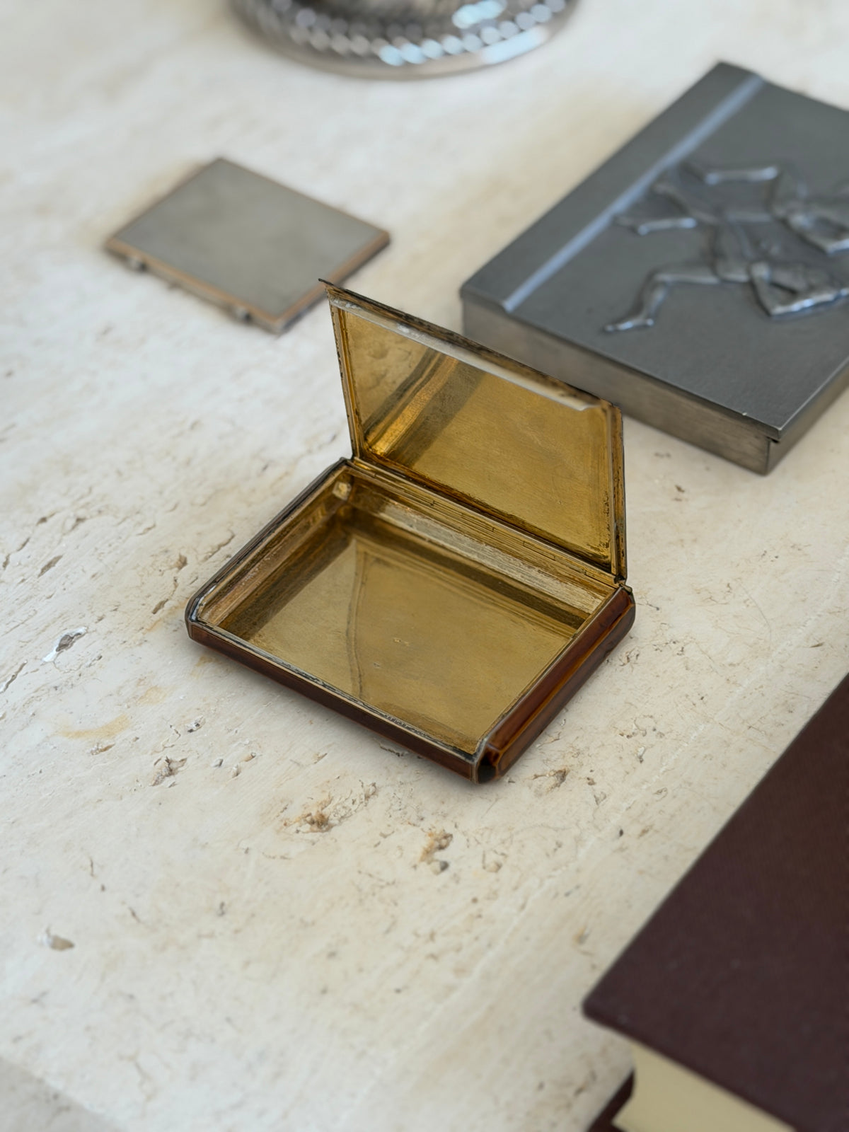 Keller Paris box opened, revealing a brushed gilt silver interior and lid lining