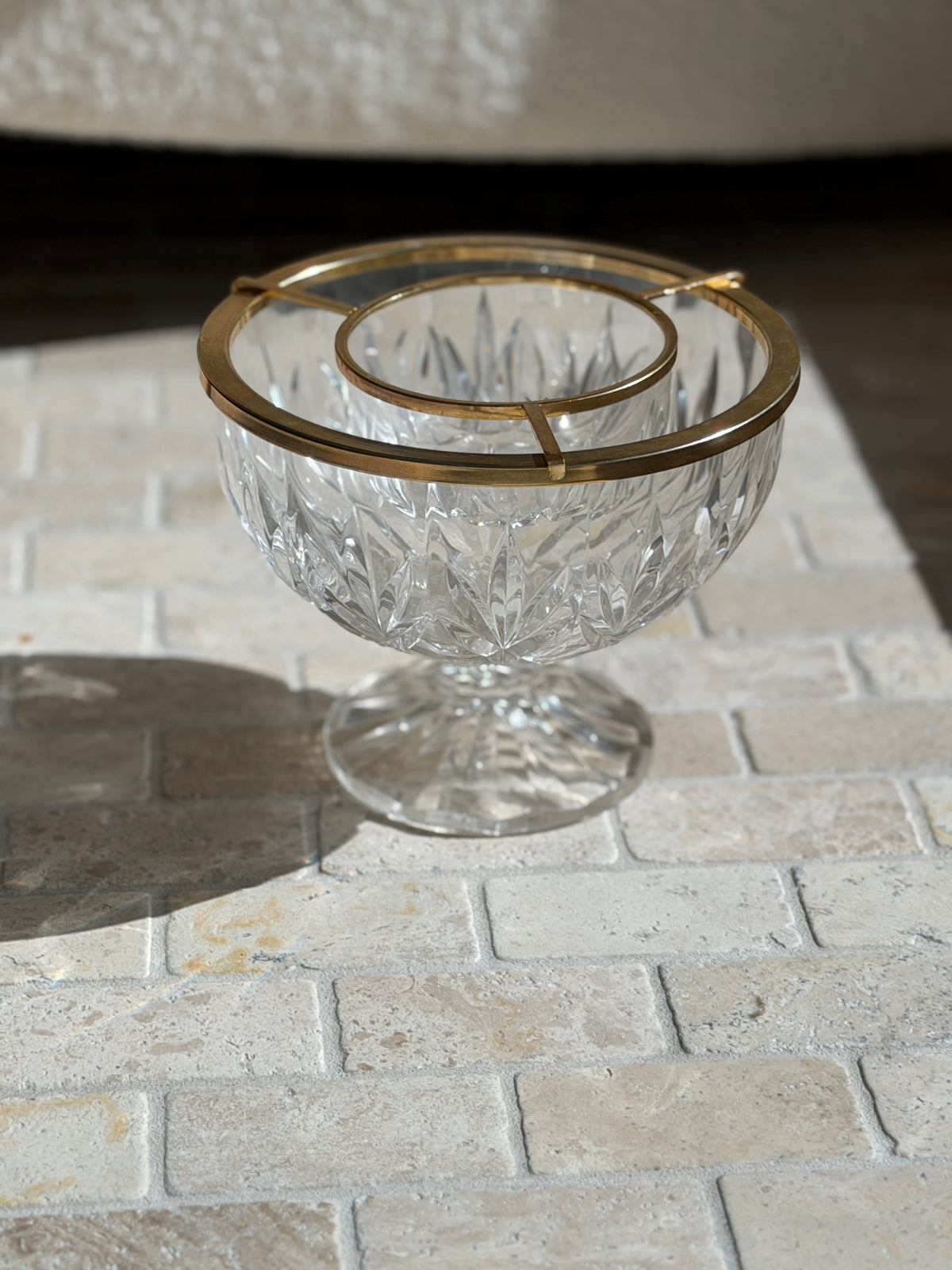 Side view of the footed crystal caviar server, showing the pointed leaf cuts on the bowl and the faceted pedestal foot