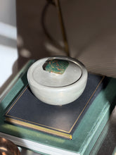 Vintage Svenskt Tenn pewter lidded bowl with bloodstone finial displayed on books from Collectors Gene