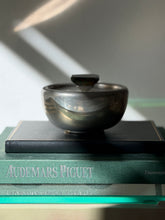 Curated shelf scene featuring Svenskt Tenn pewter and bloodstone decorative bowl at Collectors Gene