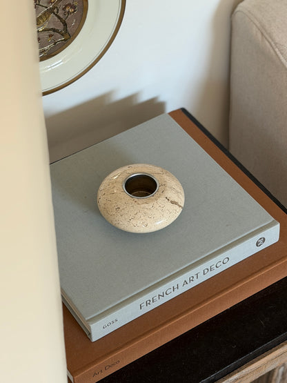 Angled side view of mid-century Italian travertine stone decorative bowl tray on executive desk surface