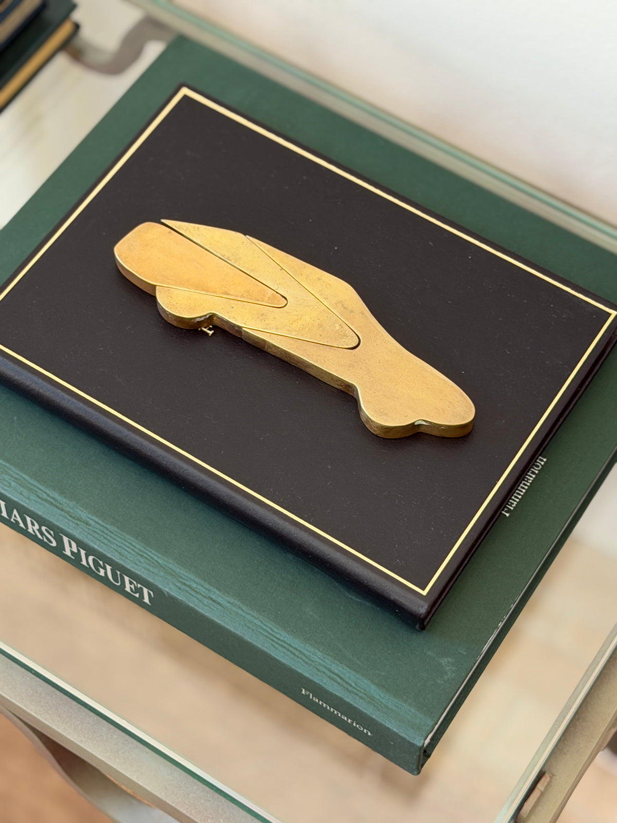 Collectors Gene vintage solid bronze 3-piece interlocking automobile paperweight displayed assembled on green book