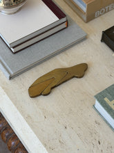 Collectors Gene modernist bronze automobile paperweight styled on executive desk context shot