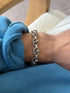 Bracelet worn on the wrist, closer view showing the interlocking link pattern
