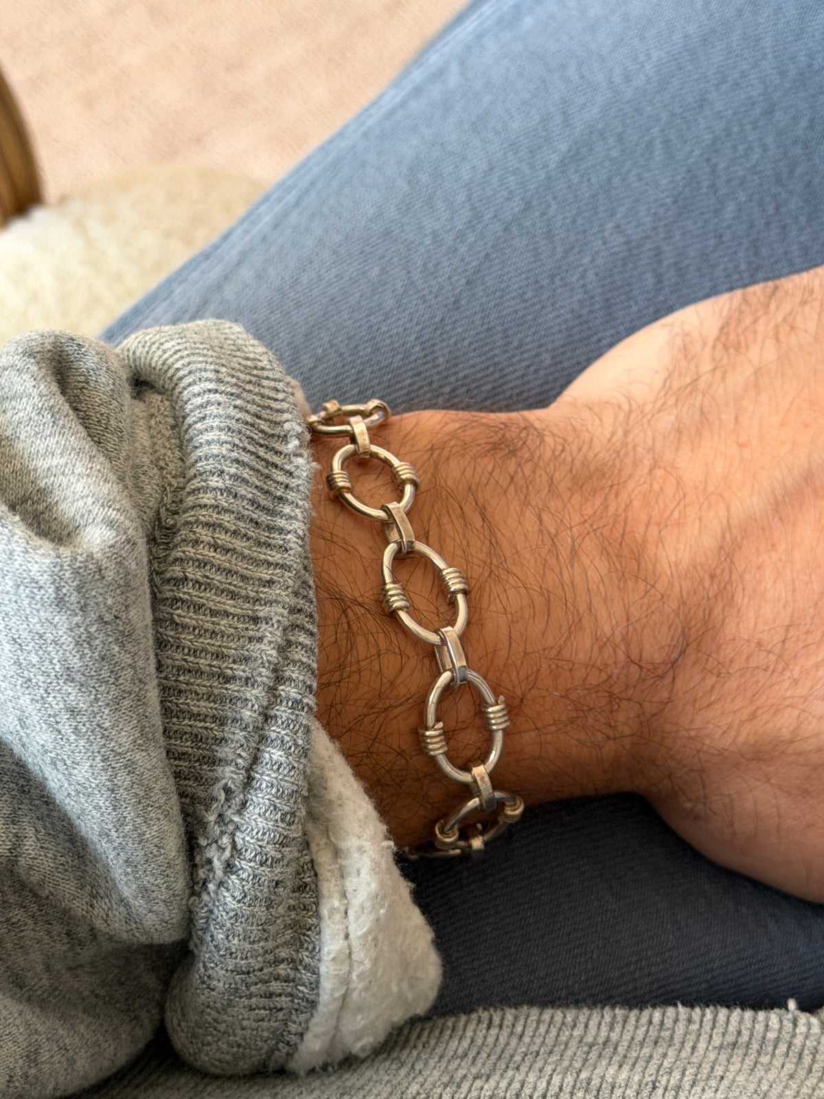 Side angle view showing the vintage silver bracelet on wrist