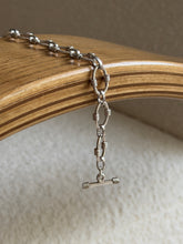 Draped view highlighting the texture contrast between the link styles